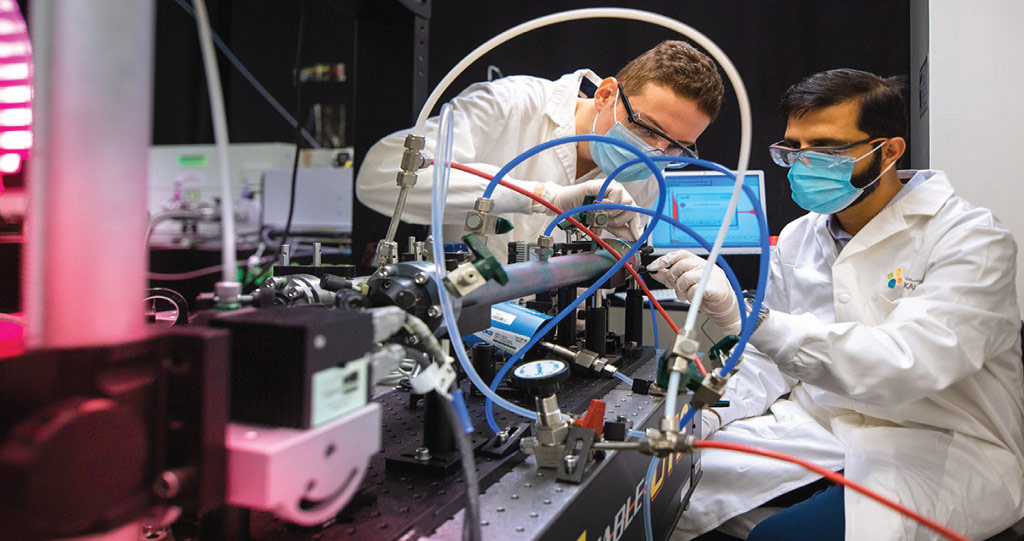 The compact laser-based sensor developed by Mhanna Mhanna (left) and Amir Farooq (right) can detect benzene at levels as low as 2 parts per billion.