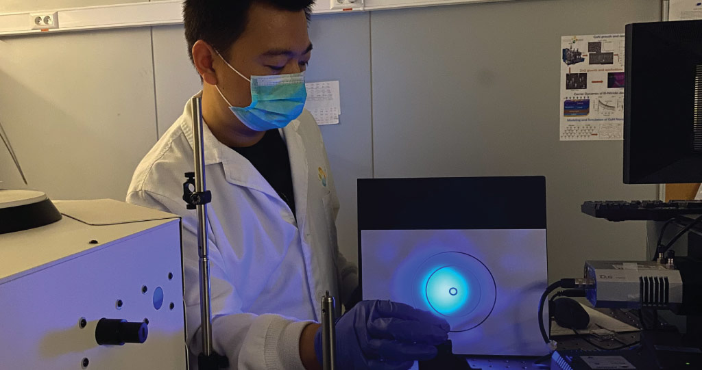 KAUST postdoc Bin Xin aligns the laser interference lithography systems used to create the array structures on the Si samples.