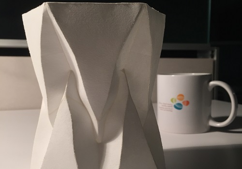 A freestanding folded structure, made from a single sheet of paper, demonstrates the software's applications.