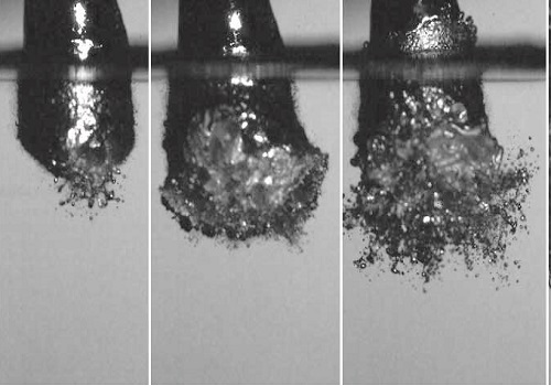 Vapor explosion of an 8 mm diameter drop of liquid Field’s metal as it falls into a pool of water.