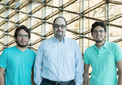 Ph.D. students Fabian Caba (left) and Victor Escorcia (right)  are working with Bernard Ghanem (center) to automate visual recognition technology.