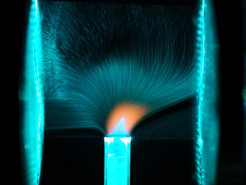 The researchers acquired incredible images, such as this one, showing a jet flame being affected by a 16-kV electric field between two electrodes.