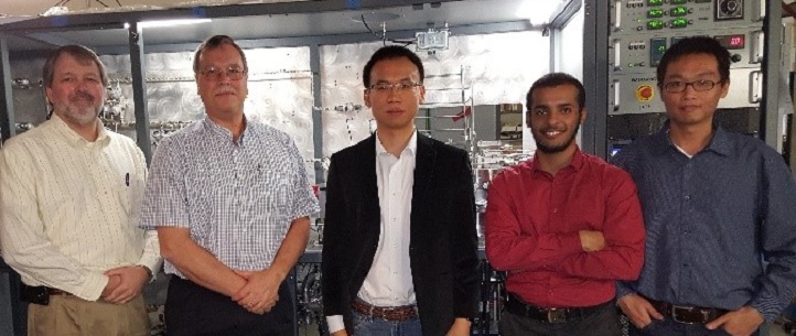 L-R: Gary Provost and Gary Tompa from Structural Materials Industries (SMI), Xiaohang Li (principal investigator), Hamad Alotaibi (undergraduate intern from King Fahd University of Petroleum and Minerals), and Kuang-Hui Li (first author) in front of a MOCVD prototype in a workshop at SMI.