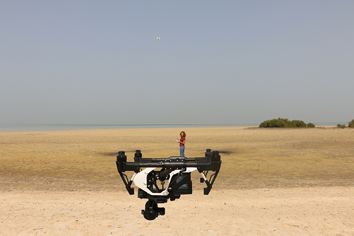 Cecilia Martin flying the drone she uses to survey plastic pollution on the shores of the Red Sea.