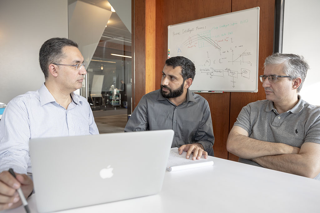 Tareq Al-Naffouri, Nasir Saeed and Mohamed-Slim Alouini (l-r) discuss how their system helps move toward the Internet of underwater things.