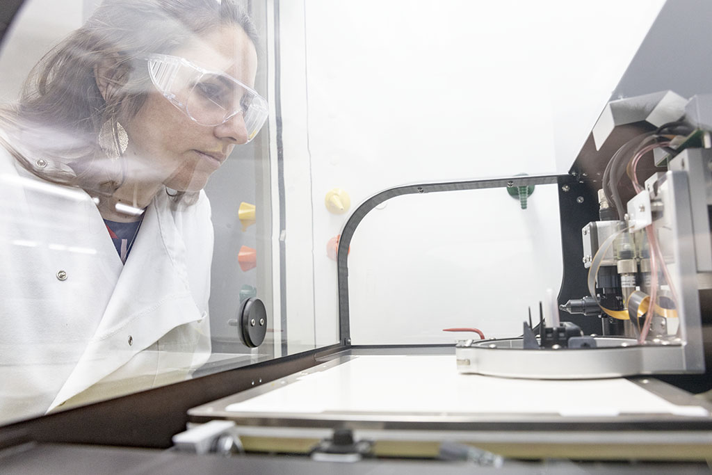 Eloise Bihar looks on as the inkjet-printed sensors are created.