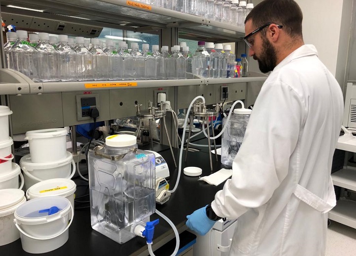 Luis Silva sets up the filtration system in the laboratory at KAUST to remove protistan grazers.