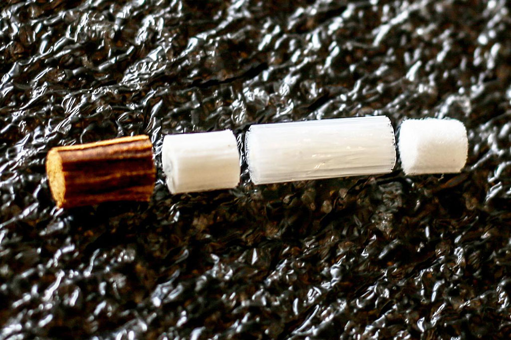 Components of the unsmoked "I quit ordinary smoking" HeatStick device. (l-r): the tobacco plug, the hollow acetate tube separating the tobacco plug and the polymer film fitter,  the polymer mesh and the cellulose acetate mouthpiece.