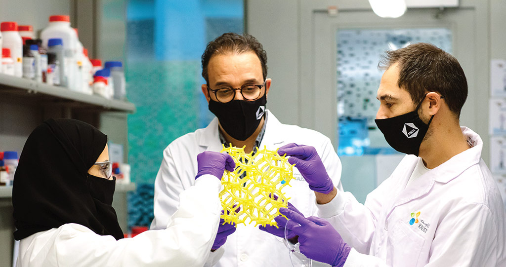 Norah Alsadun (left), Mohamed Eddaoudi (center) and Vincent Guillerm (right) drew inspiration for their MOF from inorganic porous materials called zeolites, which are a special class of porous material with myriad applications.
